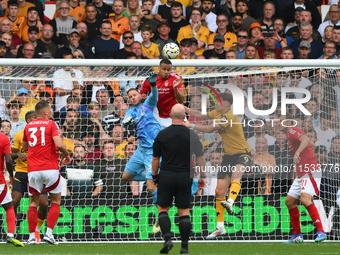 Murillo of Nottingham Forest heads the ball clear under pressure from Jorgen Strand Larsen of Wolverhampton Wanderers during the Premier Lea...