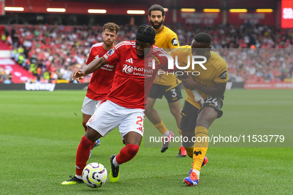 Anthony Elanga of Nottingham Forest is under pressure from Toti Gomes of Wolverhampton Wanderers during the Premier League match between Not...