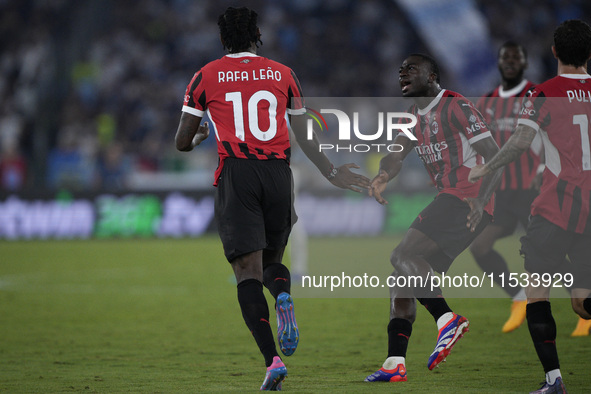 Rafael Leao of AC Milan celebrates after scoring a goal with Youssouf Fofana of AC Milan during the Serie A match between Lazio and Milan at...