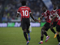 Rafael Leao of AC Milan celebrates after scoring a goal with Youssouf Fofana of AC Milan during the Serie A match between Lazio and Milan at...