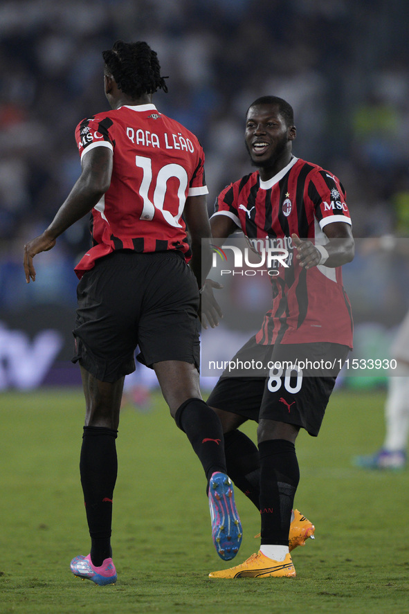 Rafael Leao of AC Milan celebrates after scoring a goal with Yunes Musah of AC Milan during the Serie A match between Lazio and Milan at Sta...