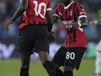 Rafael Leao of AC Milan celebrates after scoring a goal with Yunes Musah of AC Milan during the Serie A match between Lazio and Milan at Sta...