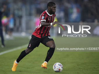 Yunes Musah of AC Milan is in action during the Serie match between Lazio and Milan at Stadio Olimpico in Rome, Italy, on August 31, 2024. (