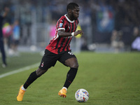 Yunes Musah of AC Milan is in action during the Serie match between Lazio and Milan at Stadio Olimpico in Rome, Italy, on August 31, 2024. (