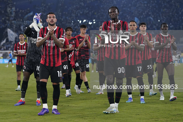 Theo Hernandez of AC Milan and Tammi Abraham of AC Milan greet the fans at the end of the Serie A match between Lazio and Milan at Stadio Ol...