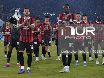 Theo Hernandez of AC Milan and Tammi Abraham of AC Milan greet the fans at the end of the Serie A match between Lazio and Milan at Stadio Ol...