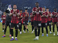 Theo Hernandez of AC Milan and Tammi Abraham of AC Milan greet the fans at the end of the Serie A match between Lazio and Milan at Stadio Ol...