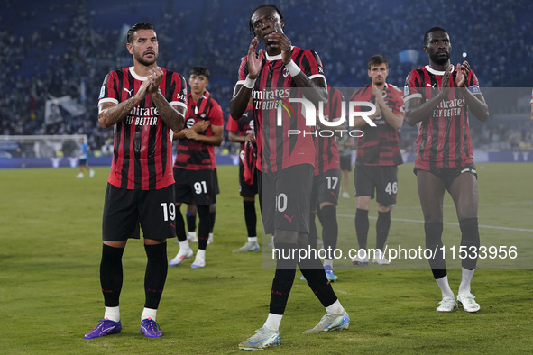 Theo Hernandez of AC Milan (L), Tammy Abraham of AC Milan (C), and Fikayo Tomori of AC Milan (R) greet the fans at the end of the Serie A ma...