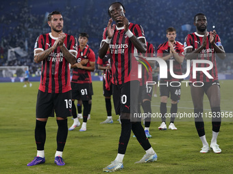 Theo Hernandez of AC Milan (L), Tammy Abraham of AC Milan (C), and Fikayo Tomori of AC Milan (R) greet the fans at the end of the Serie A ma...