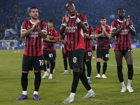 Theo Hernandez of AC Milan (L), Tammy Abraham of AC Milan (C), and Fikayo Tomori of AC Milan (R) greet the fans at the end of the Serie A ma...