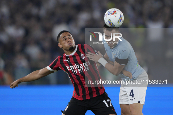 Noah Okafor of AC Milan competes for the ball with Patric of S.S. Lazio during the Serie A match between Lazio and Milan at Stadio Olimpico...