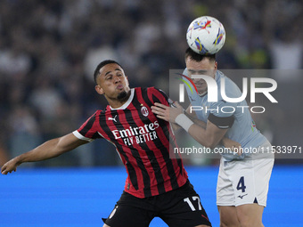 Noah Okafor of AC Milan competes for the ball with Patric of S.S. Lazio during the Serie A match between Lazio and Milan at Stadio Olimpico...