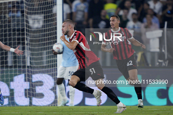 Strahinja Pavlovic of AC Milan celebrates after scoring a goal during the Serie A match between Lazio and Milan at Stadio Olimpico in Rome,...