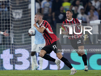 Strahinja Pavlovic of AC Milan celebrates after scoring a goal during the Serie A match between Lazio and Milan at Stadio Olimpico in Rome,...