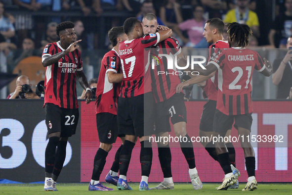 Strahinja Pavlovic of AC Milan celebrates after scoring a goal with his teammates during the Serie A match between Lazio and Milan at Stadio...