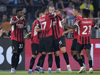 Strahinja Pavlovic of AC Milan celebrates after scoring a goal with his teammates during the Serie A match between Lazio and Milan at Stadio...