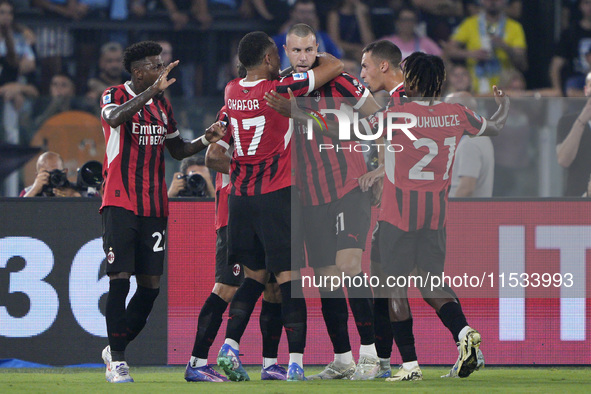 Strahinja Pavlovic of AC Milan celebrates after scoring a goal with his teammates during the Serie A match between Lazio and Milan at Stadio...