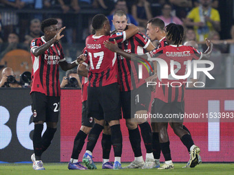 Strahinja Pavlovic of AC Milan celebrates after scoring a goal with his teammates during the Serie A match between Lazio and Milan at Stadio...