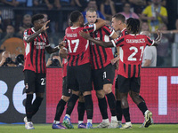 Strahinja Pavlovic of AC Milan celebrates after scoring a goal with his teammates during the Serie A match between Lazio and Milan at Stadio...