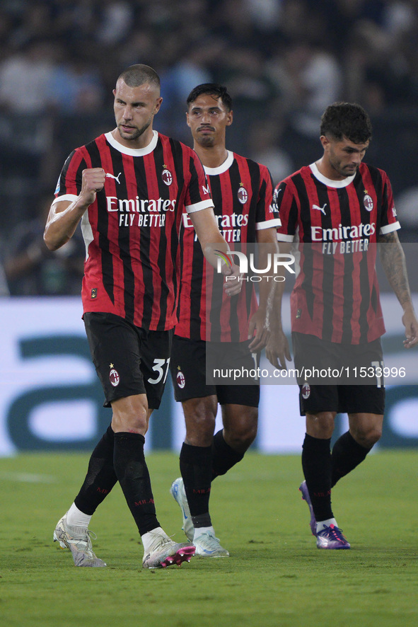 Strahinja Pavlovic of AC Milan celebrates after scoring a goal during the Serie A match between Lazio and Milan at Stadio Olimpico in Rome,...