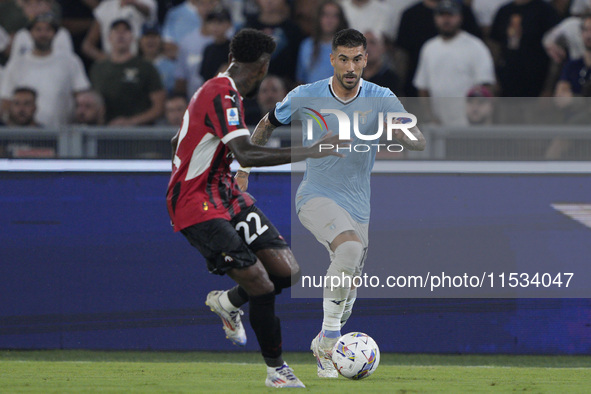 Mattia Zaccagni of S.S. Lazio competes for the ball with Emerson Royal of AC Milan during the Serie A match between Lazio and Milan at Stadi...