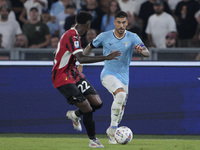 Mattia Zaccagni of S.S. Lazio competes for the ball with Emerson Royal of AC Milan during the Serie A match between Lazio and Milan at Stadi...