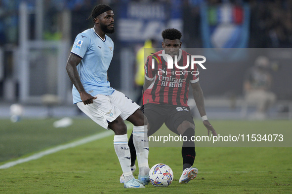 Nuno Albertino Varela Tavares of S.S. Lazio competes for the ball with Emerson Royal of AC Milan during the Serie match between Lazio and Mi...