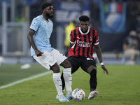 Nuno Albertino Varela Tavares of S.S. Lazio competes for the ball with Emerson Royal of AC Milan during the Serie match between Lazio and Mi...