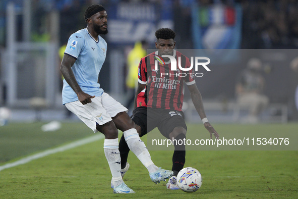 Nuno Albertino Varela Tavares of S.S. Lazio competes for the ball with Emerson Royal of AC Milan during the Serie match between Lazio and Mi...