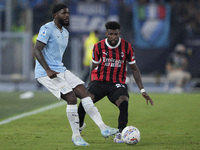 Nuno Albertino Varela Tavares of S.S. Lazio competes for the ball with Emerson Royal of AC Milan during the Serie match between Lazio and Mi...