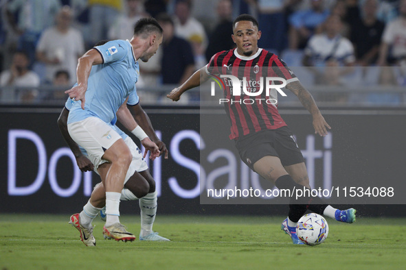 Noah Okafor of AC Milan is in action during the Serie A match between Lazio and Milan at Stadio Olimpico in Rome, Italy, on August 31, 2024....