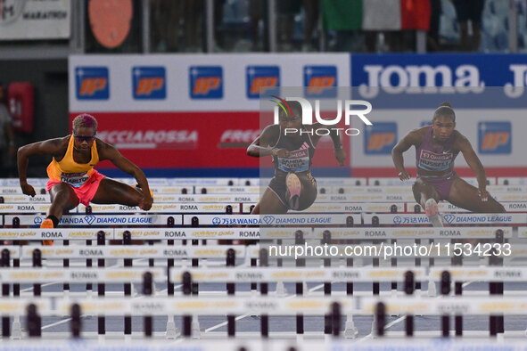 Devynne Charlton (BAH), Cyrena Samba-Mayela (FRA), and Janieve Russell (JAM) compete in the 100m Hurdles Women and the 400m Hurdles Women du...