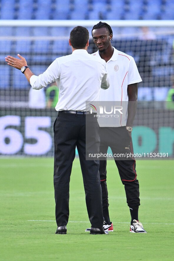 Paulo Fonseca, coach of A.C. Milan, and Tammy Abraham during the 3rd day of the Serie A Championship between S.S. Lazio and A.C. Milan at th...