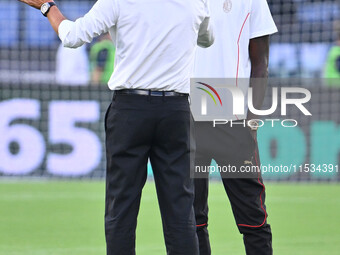 Paulo Fonseca, coach of A.C. Milan, and Tammy Abraham during the 3rd day of the Serie A Championship between S.S. Lazio and A.C. Milan at th...