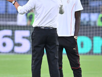 Paulo Fonseca, coach of A.C. Milan, and Tammy Abraham during the 3rd day of the Serie A Championship between S.S. Lazio and A.C. Milan at th...