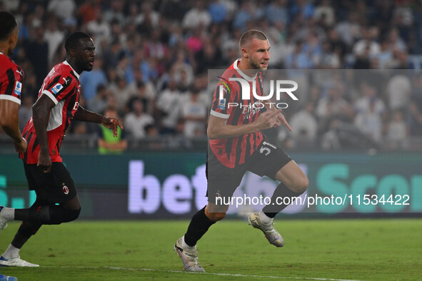 Strahinja Pavlovic of A.C. Milan celebrates after scoring the goal of 0-1 during the 3rd day of the Serie A Championship between S.S. Lazio...