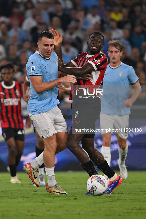 Patric of S.S. Lazio and Youssouf Fofana of A.C. Milan during the 3rd day of the Serie A Championship between S.S. Lazio and A.C. Milan at t...