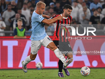 Gustav Isaksen of S.S. Lazio and Christian Pulisic of A.C. Milan during the 3rd day of the Serie A Championship between S.S. Lazio and A.C....