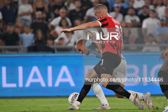 Strahinja Pavlovic of A.C. Milan and Gustav Isaksen of S.S. Lazio during the 3rd day of the Serie A Championship between S.S. Lazio and A.C....