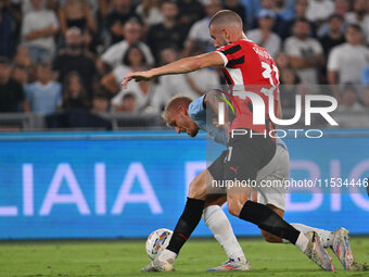 Strahinja Pavlovic of A.C. Milan and Gustav Isaksen of S.S. Lazio during the 3rd day of the Serie A Championship between S.S. Lazio and A.C....