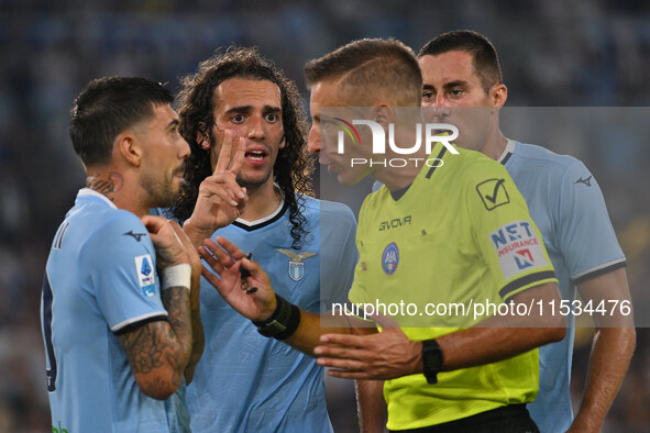 Mattia Zaccagni of S.S. Lazio and Referee Davide Massa during the 3rd day of the Serie A Championship between S.S. Lazio and A.C. Milan at t...