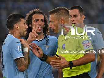 Mattia Zaccagni of S.S. Lazio and Referee Davide Massa during the 3rd day of the Serie A Championship between S.S. Lazio and A.C. Milan at t...