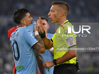 Mattia Zaccagni of S.S. Lazio and Referee Davide Massa during the 3rd day of the Serie A Championship between S.S. Lazio and A.C. Milan at t...