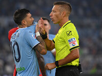 Mattia Zaccagni of S.S. Lazio and Referee Davide Massa during the 3rd day of the Serie A Championship between S.S. Lazio and A.C. Milan at t...