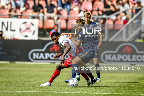 FC Utrecht player Noah Ohio and FC Twente player Mathias Kjolo during the match between Utrecht and Twente at Stadium Galgenwaard for the Du...