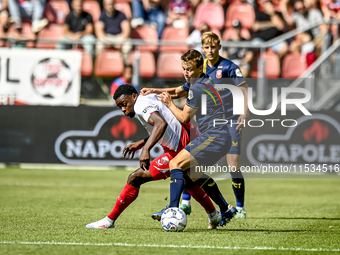 FC Utrecht player Noah Ohio and FC Twente player Mathias Kjolo during the match between Utrecht and Twente at Stadium Galgenwaard for the Du...