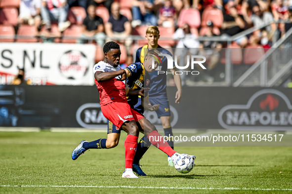 FC Utrecht player Noah Ohio and FC Twente player Mathias Kjolo during the match between Utrecht and Twente at Stadium Galgenwaard for the Du...