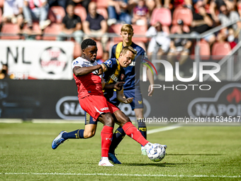 FC Utrecht player Noah Ohio and FC Twente player Mathias Kjolo during the match between Utrecht and Twente at Stadium Galgenwaard for the Du...