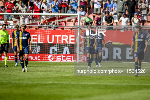 Players of FC Twente are disappointed after the goal of FC Utrecht player Jens Toornstra, making the score 1-1, during the match between Utr...