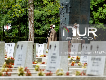 Military servicemen stand by the monument to the unknown soldier during the a ceremony commemorating 85. anniversary of an the outbreak of t...